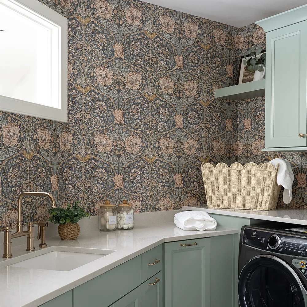 Laundry room with wallpaper in William Morris Honeysuckle by peacoquettedesigns.