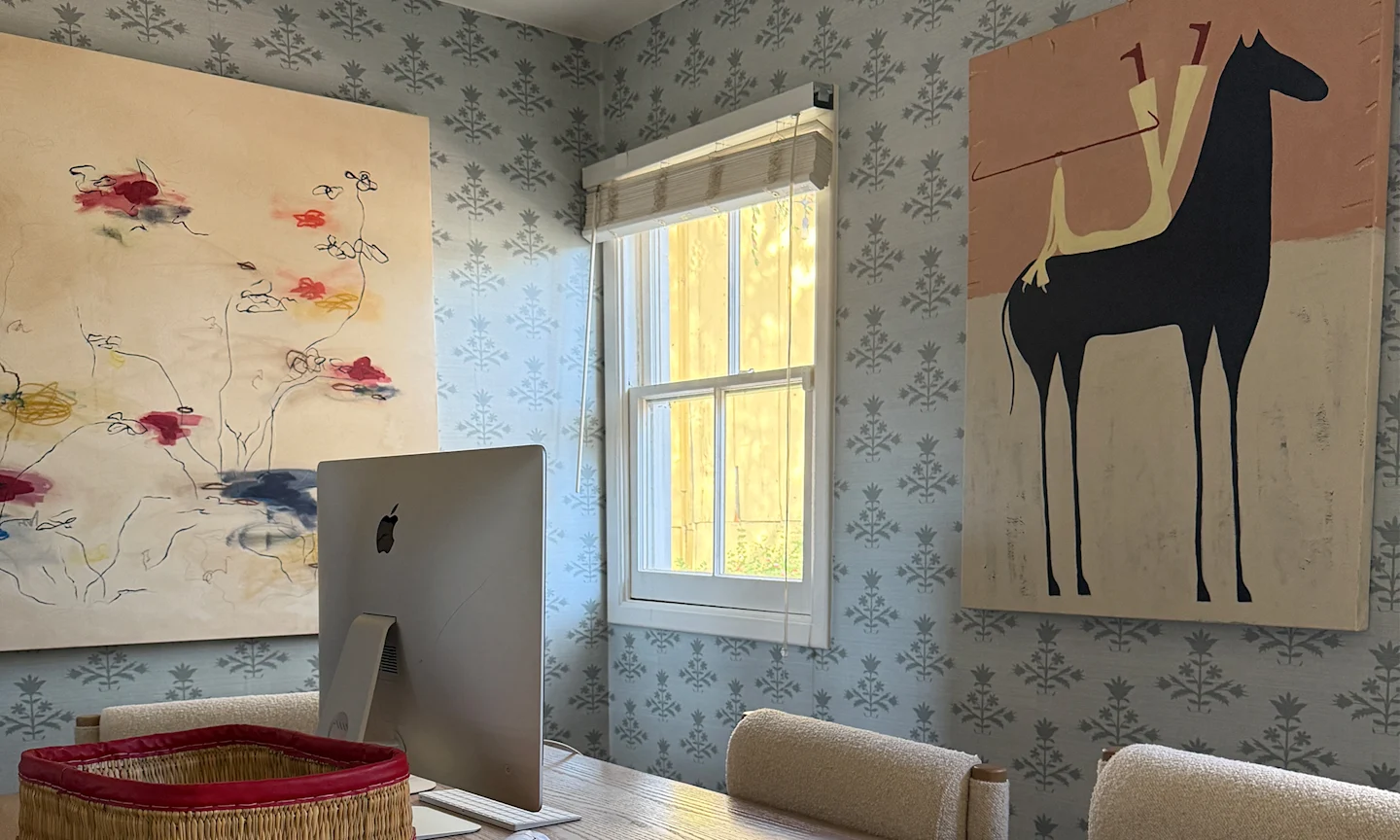 Office space with sage blue floral block printed wallpaper.