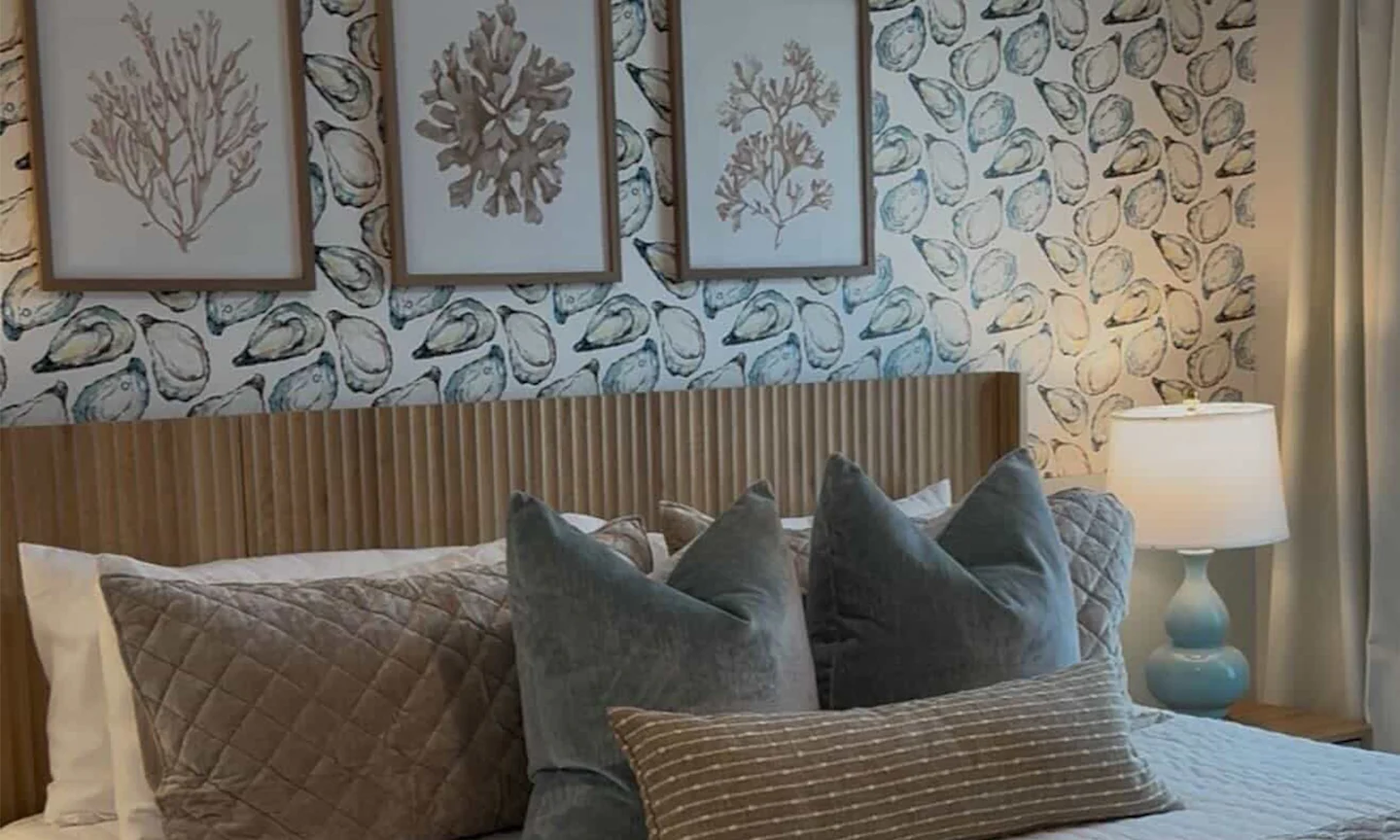 Bedroom with oyster wallpaper.