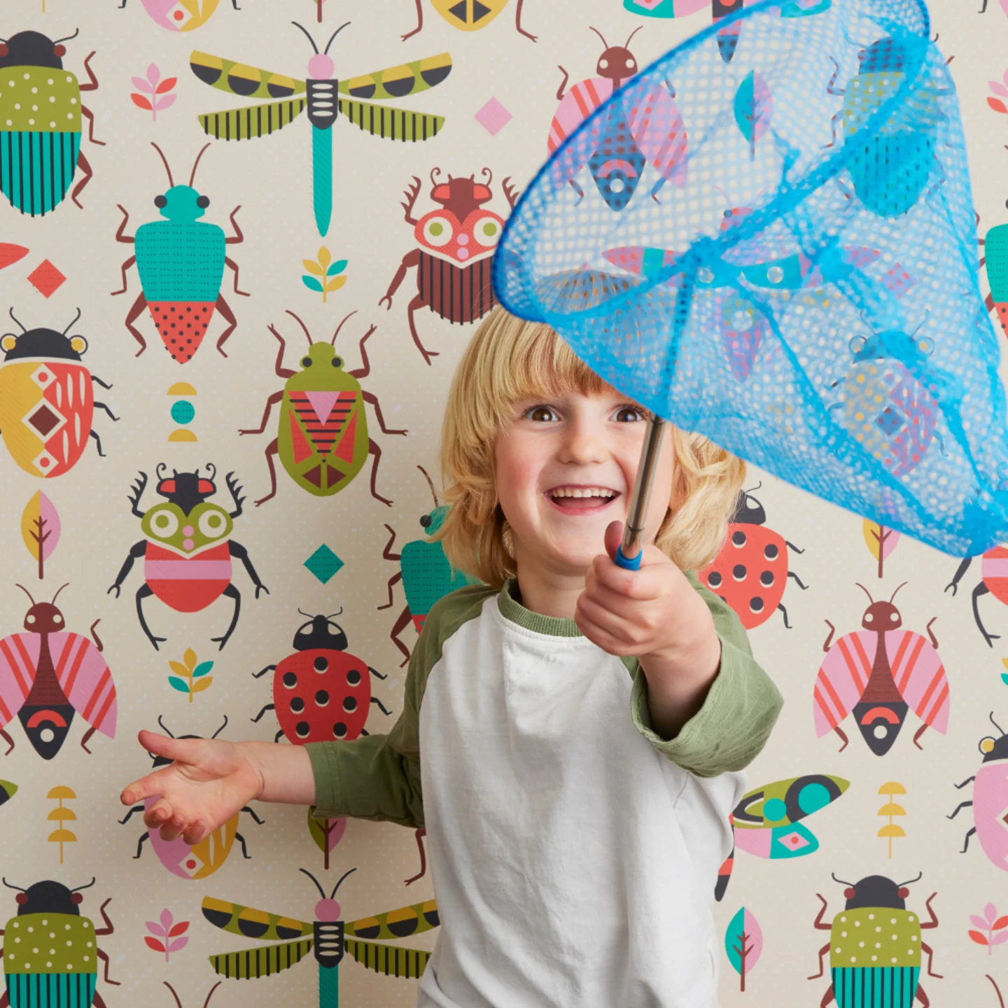 Child with bug themed wallpaper
