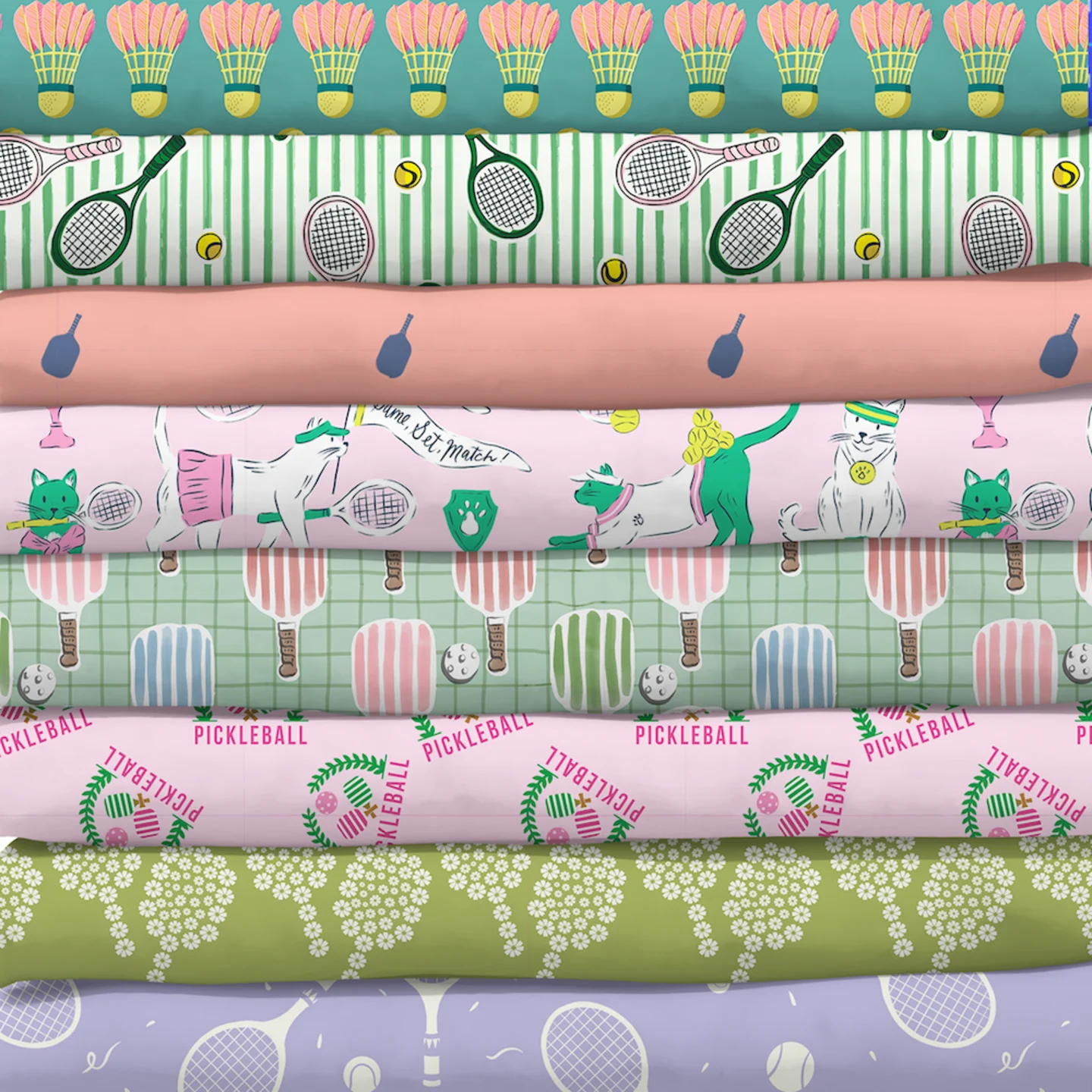 Stack of sports themed fabrics